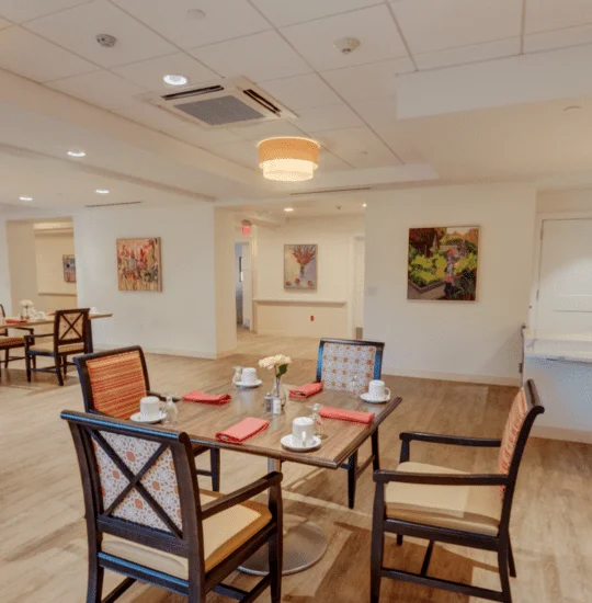 Senior dining area and kitchen at Oak Trace Senior Living Community