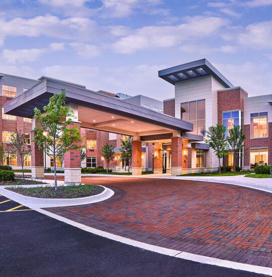 Entrance at Oak Trace Senior Living Community at sunset