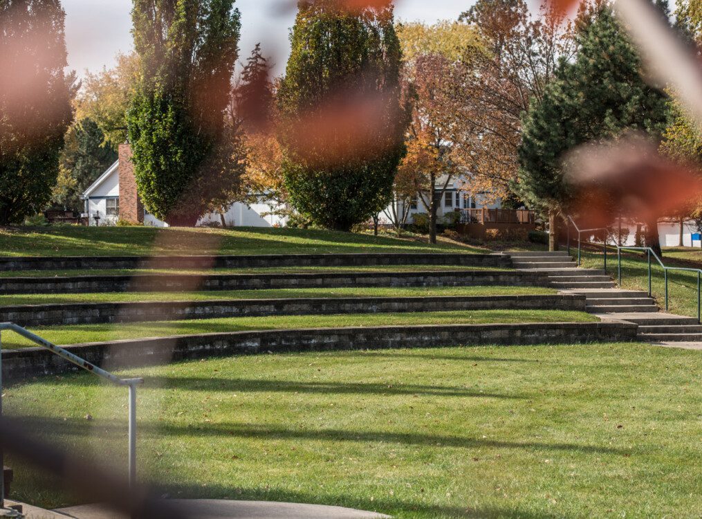 Outdoor amphitheater covered with grass at Oak Trace Senior Living Community