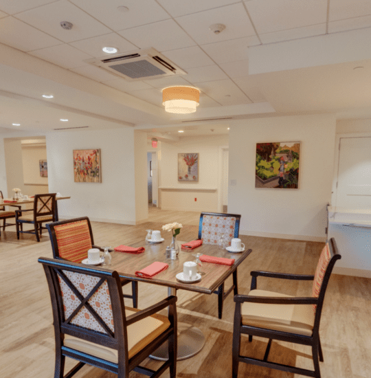 Senior dining area and kitchen at Oak Trace Senior Living Community