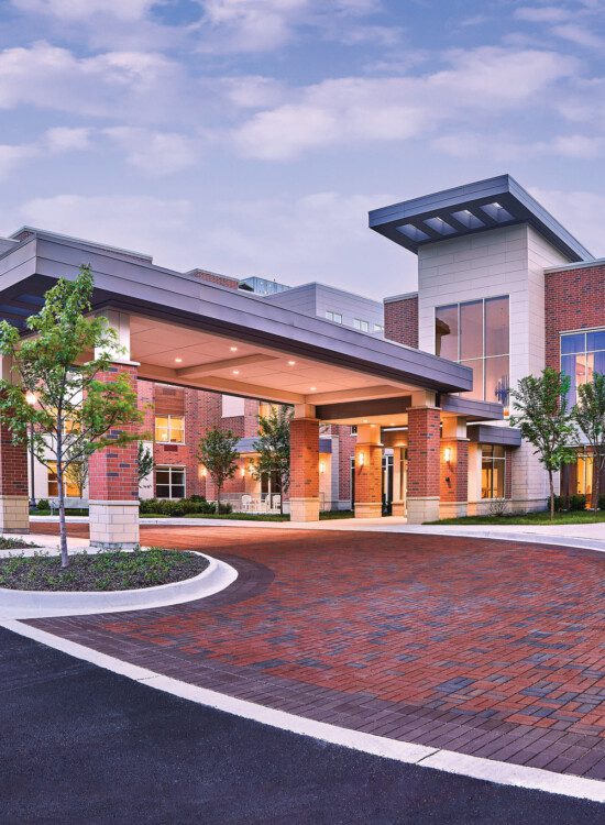 Entrance at Oak Trace Senior Living Community at sunset